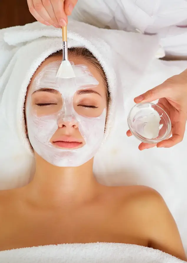 Woman enjoying a spa facial in Newton KS at SurePose Massage and Day Spa
